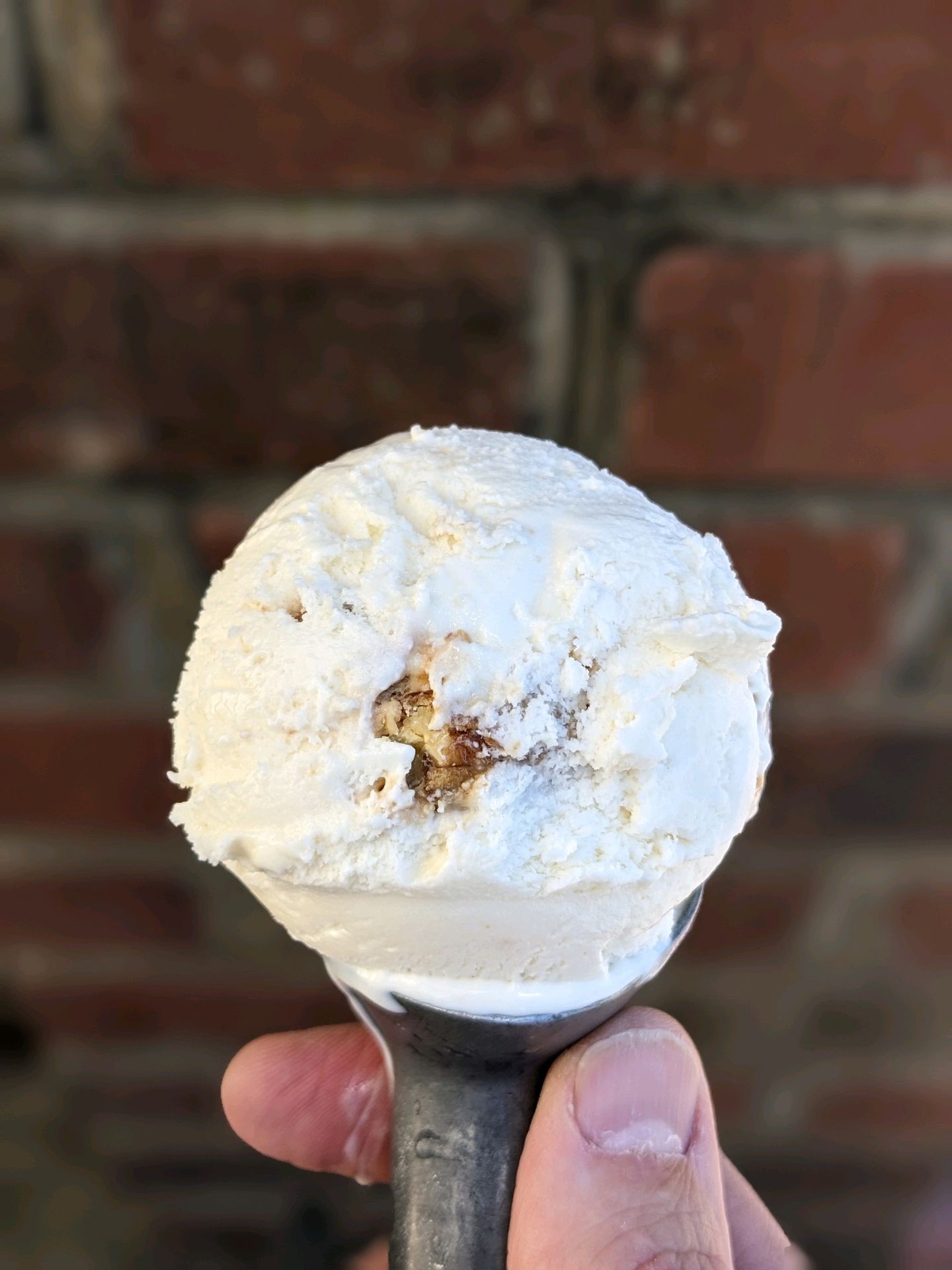 Scoop of praline butter pecan ice cream