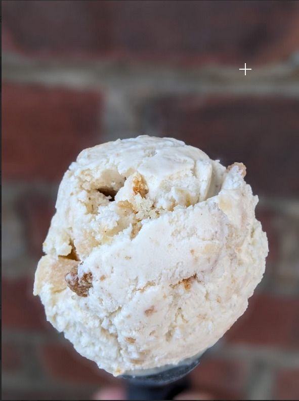 Picture of ice cream with chunks of delicious apples and cinnamon cake.